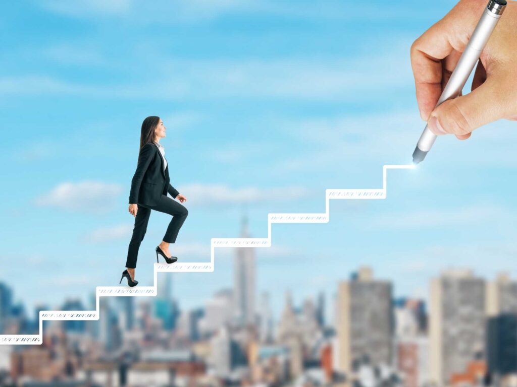 woman climbing metaphorical staircase being drawn by person
