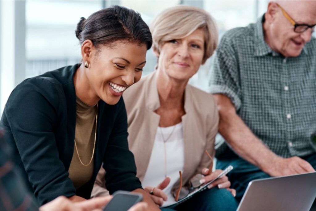 Two women and one man in a professional setting
