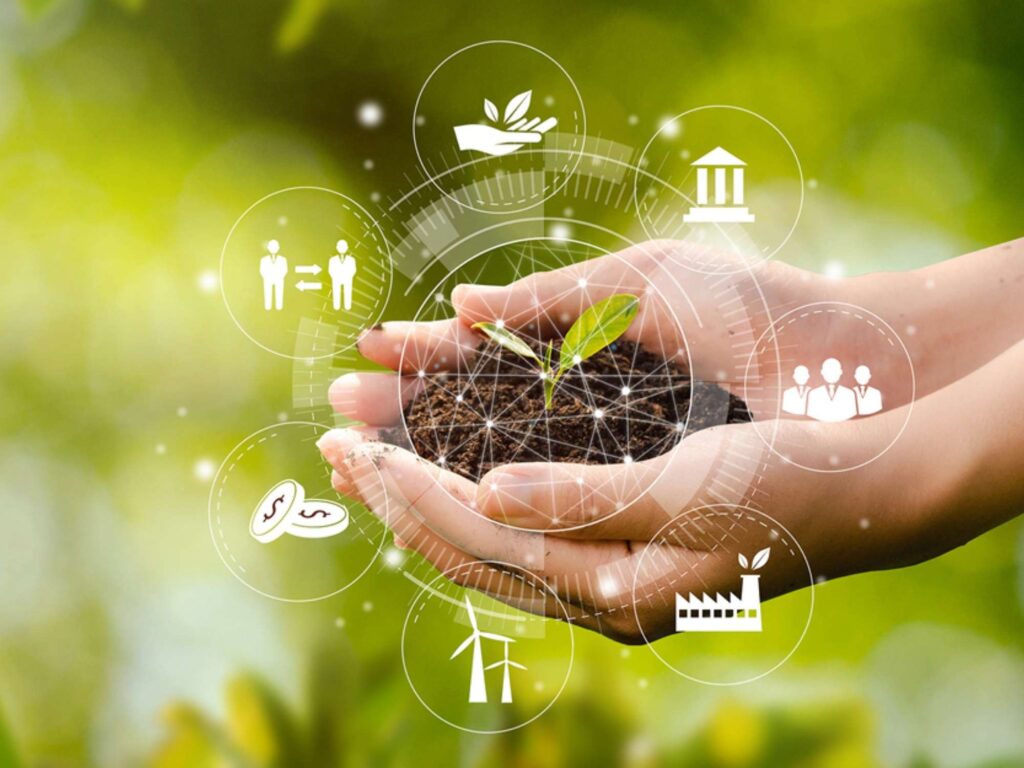 A circle of technology inside of a hand holding a sand with plant on top